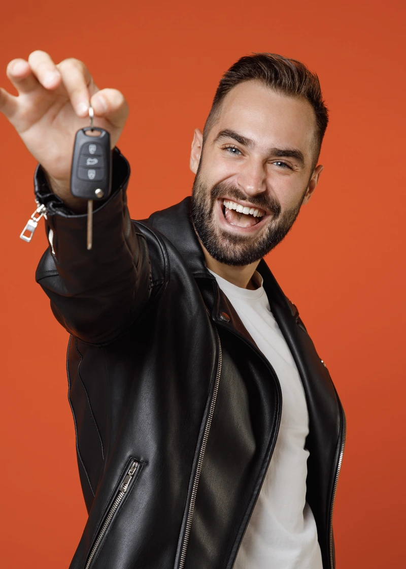 Happy driver with car keys
