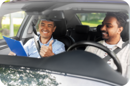 Driving instructor with student in car
